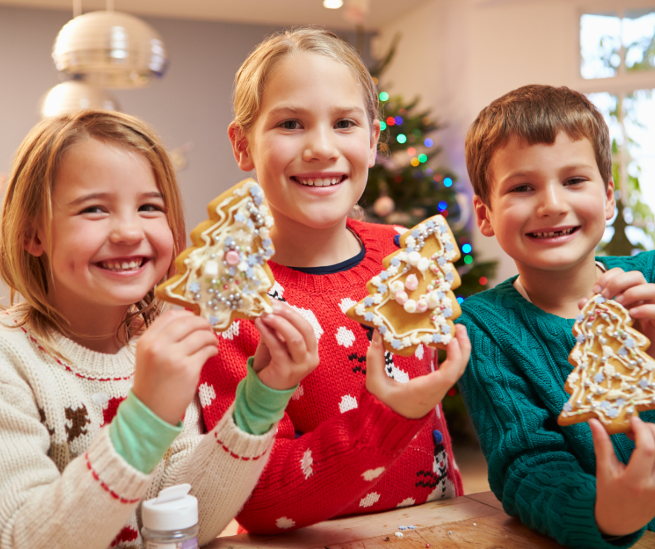 children holding christmas holiday cookies