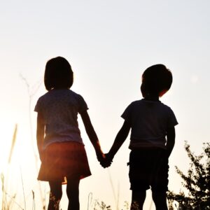 Little boy and little girl holding hands