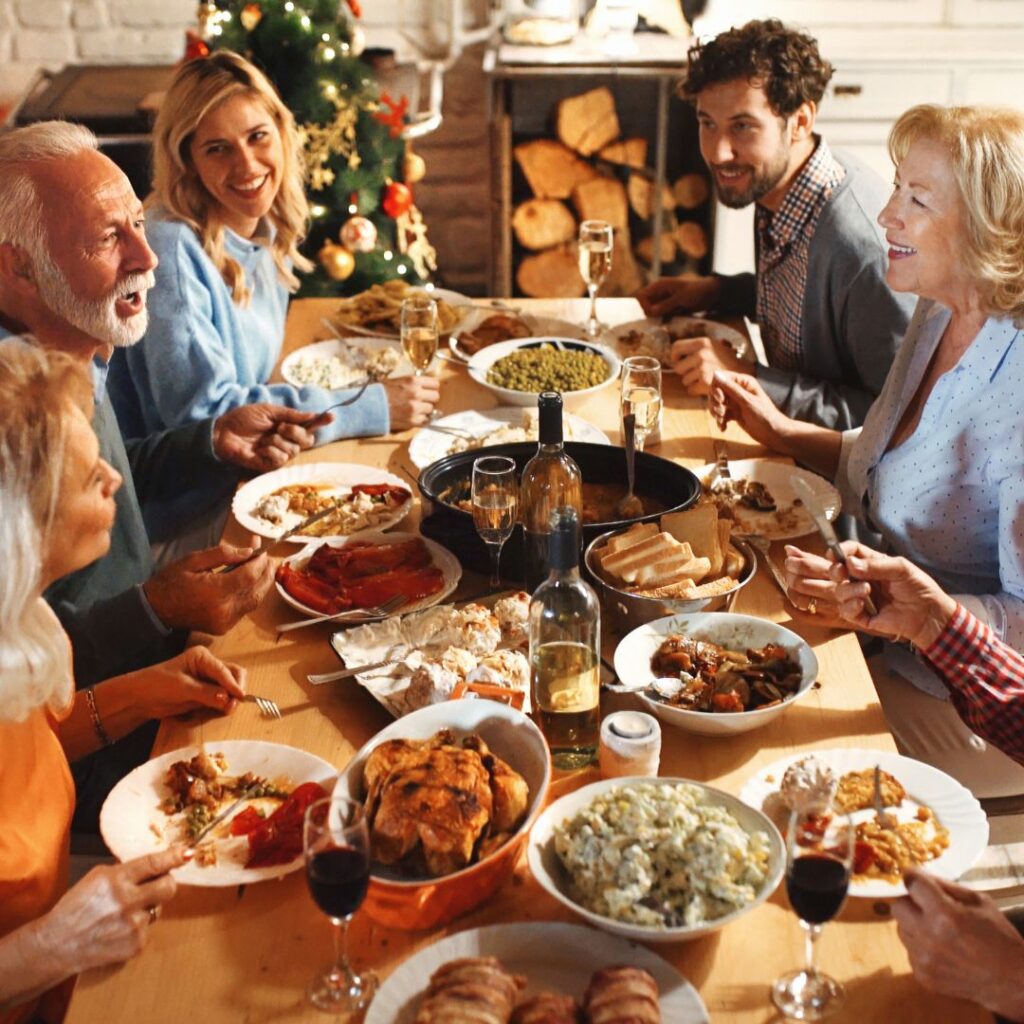 Family sitting at table having holiday dinner