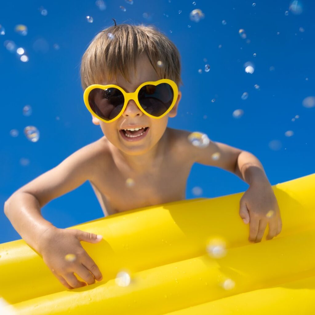 Little boy with raft.