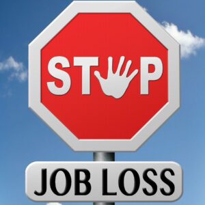 Stop sign with job loss underneath