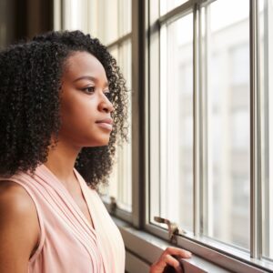 Woman looking out of window