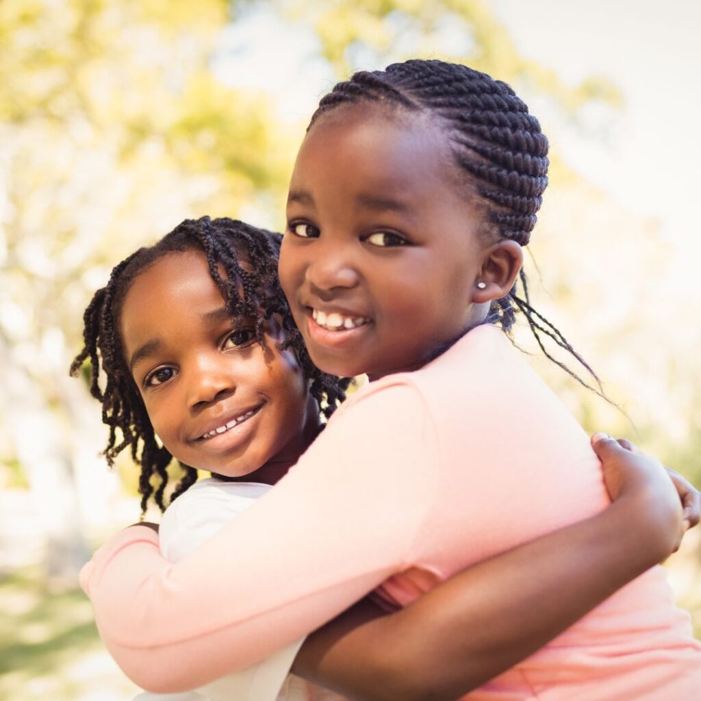 Two little girls hugging