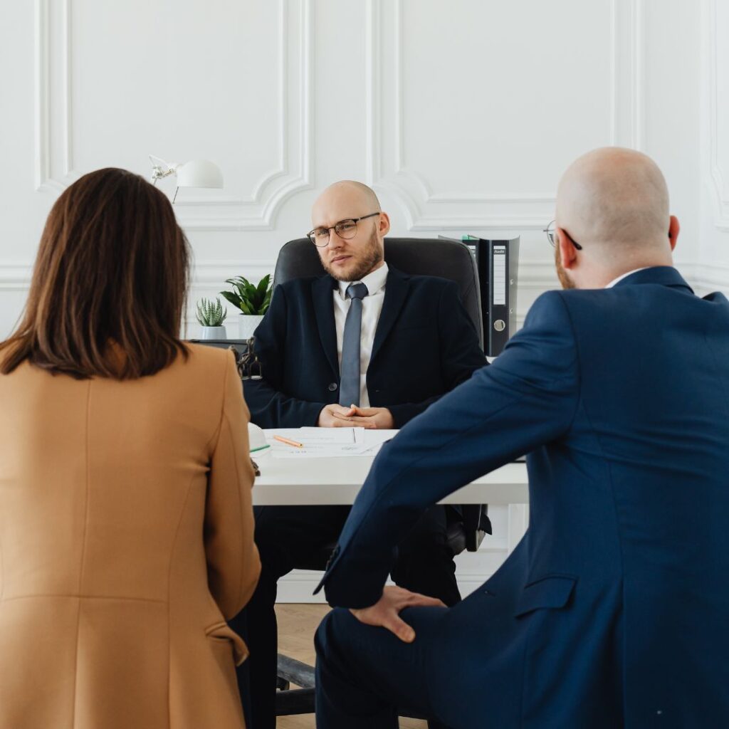 Couple talking to divorce lawyer