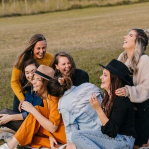 Women gathering on the grass.
